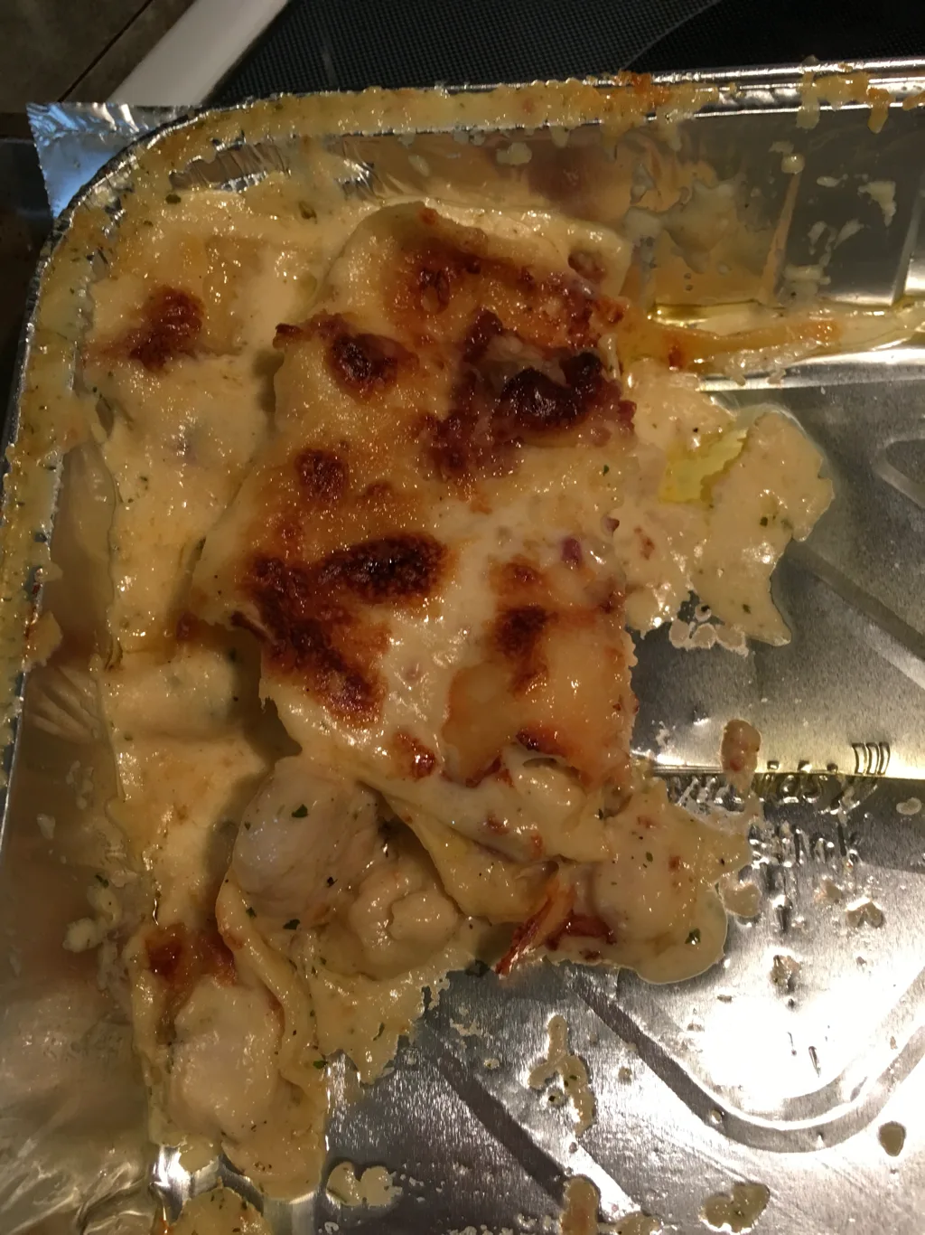 a mostly eaten pan of chicken bacon ranch lasagna